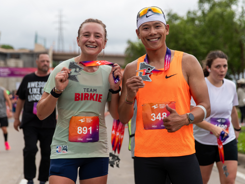 Alayna Sonnesyn and Ben John show off their new medals